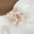 Elegant champagne silk satin scrunchie with delicate ribbon bows for balletcore hair styling - Off-white
