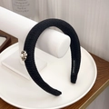 Elegant black braided headband for women featuring a delicate pearl flower metal accent - Black Camellia Style