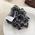 Classic black and white striped fabric scrunchie with woven label on ceramic tray - Black & White Stripes