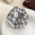 Handmade scrunchie featuring black and white fine stripes on soft fabric texture - Grey Stripe