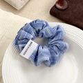 French blue striped fabric scrunchie with pleated texture and white brand label - Blue Stripe