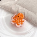 Pince à cheveux pieuvre mignonne avec texture marbre orange et bords roses ondulés - Style Poulpe Volcan