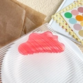 Elegant coral pink cloud-shaped hair claw clip with a stylish textured wavy finish - Red Stripe