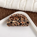 Elegant semi-circular amber leopard print hair claw clip on a white ceramic tray - Half Round-Coffee