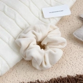 White fuzzy velvet scrunchie hair tie with soft plush texture for elegant hairstyles - Off White