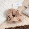 Soft plush hair scrunchie in warm light brown color with fluffy lamb wool texture - Nude