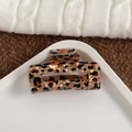 Chic rectangular leopard print hair claw clip in amber brown with a glossy finish - Medium-Coffee