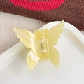 Pale yellow butterfly acrylic hair claw clip with elegant marble texture finish - Iridescent Yellow