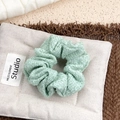Light green tweed scrunchie with premium woven texture for elegant hair styling - Cyan