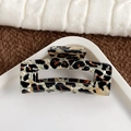 Large rectangular leopard print hair claw clip on a stylish fabric and ceramic background - Large-Cyan