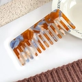 Elegant wide-tooth hair comb with amber orange marble pattern in a stylish acetate finish - Yellow Blue