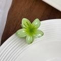 Elegant pale green plumeria flower hair claw clip with a matte resin finish - Cyan