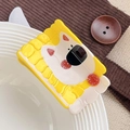 Cute yellow acetate dog hair claw clip with strawberry patterns on a white plate - Biscuit Dog