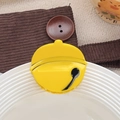 Cute yellow acetate dog bell hair claw clip for women on a white decorative plate - Bell