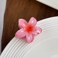 Elegant gradient pink plumeria hair claw clip with glossy translucent resin finish - Pink
