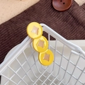 Cute yellow coin-shaped hair clip for Chinese New Year with hollow geometric pattern - Dollar