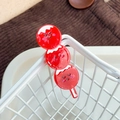 Cute red triple-ball hair clip with cartoon expressions for Chinese New Year styling - Sugar Coated Haws