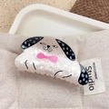 Pearlescent white acrylic dog hair claw clip with black dots and pink bow accent - Bowtie Dog