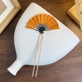 Traditional folding fan hair pin with orange petals and golden double prong detail - Bronze