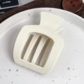 Molla per capelli trapezoidale geometrica bianco crema opaca in un ambiente accogliente - Bianco