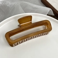 Vintage bernstein Haarklammer aus Holzmaserung mit hohlem Rechteck-Design auf Teller - Bernstein-Rechteckig