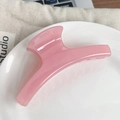 Minimalist jelly pink hair claw clip in translucent resin finish for versatile hair styling - Crescent Moon