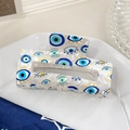 Haarklammer mit Nazar-Auge-Muster in Perlweiß mit blauen und gelben Akzenten - Gelbe Wimpern Auge