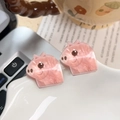 Pair of pink acrylic hair clips with pearlescent finish in a cute cartoon pig character design - Little Pig