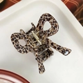 Pinza para el cabello con lazo de leopardo y resorte metálico dorado en resina - Estampado de leopardo