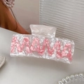 Pearly white acetate claw clip featuring pink MAMA lettering for elegant hair styling - MAMA Pink White