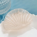 Shell-shaped ivory resin hair claw clip with a pearlescent finish and relief stripes - Beige Shell