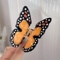 Pinza per capelli a farfalla media con motivi nero arancio e bianco da donna - Farfalla