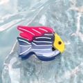 Blue tropical fish acetate hair clip with yellow and pink details on blue water texture - Striped Blue Tropical Fish