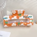 Pince à cheveux orange avec motifs de fleurs blanches et texte Flower bleu - Orange