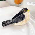 Unieke zwart-witte acetaat vogel haarklem met een glanzende marmeren textuur - Zwarte Mus Stijl