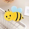 Cute yellow bee hair clip crafted from smooth acetate with black stripes and blue wings - Bee