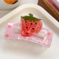 Pink pearlescent acetate hair claw clip featuring a 3D strawberry motif and white lettering - Strawberry