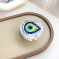 Round acetate evil eye hair claw clip with blue eye pattern and black eyelash details - Eye 3