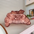 Pearlescent croissant hair claw clip in mocha brown with dark bow pattern - Croissant