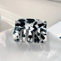 Elegant square acetate hair claw clip featuring a classic black and white marble pattern - Cow Pattern