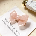 Pink marble acetate bow hair clip with gold metal grip for elegant styling - Peach