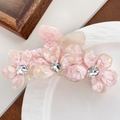 Pince à cheveux fleurie en acétate rose et blanc avec strass et texture marbrée - Rose