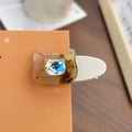 Cat-shaped acetate hair clip featuring amber tortoise pattern and blue rhinestone - Medium / Tea Brown