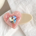 Pink heart-shaped acrylic hair clip with shimmering crystal center on a cream base - 4.5CM / Pink
