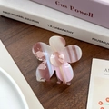 Chic pink gradient flower hair claw clip in acetate resin on a dark wooden table - Brown 6.8cm