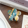 Floral claw clip with blue and yellow striped pattern on a wooden surface - Blue 6.8cm