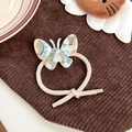 Elastico per capelli con farfalla in acetato marmorizzato e cordino beige premium - Blu Bianco Floreale