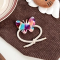 Élastique à cheveux papillon en acétate coloré avec cordon en spirale crème et embout doré - Multicolore