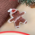 Glitzernde Lebkuchenmann-Haarklammer mit Weihnachtsmütze für festliche Frisuren - Lebkuchenmann
