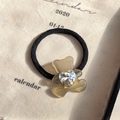 Elastic hair tie featuring a brown acetate bear pendant with a heart-shaped crystal detail - Luminous Gray